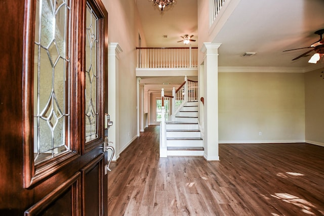 8819 Aubrey Ln, Richmond, TX 77469 - foyer featuring ornate columns, ceiling fan, stairs, and baseboards