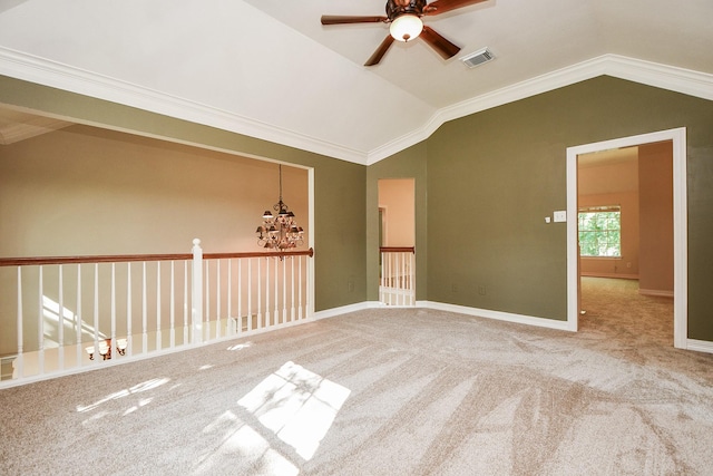 8819 Aubrey Ln, Richmond, TX 77469 - unfurnished room with vaulted ceiling, ceiling fan with notable chandelier, carpet flooring, visible vents, and crown molding