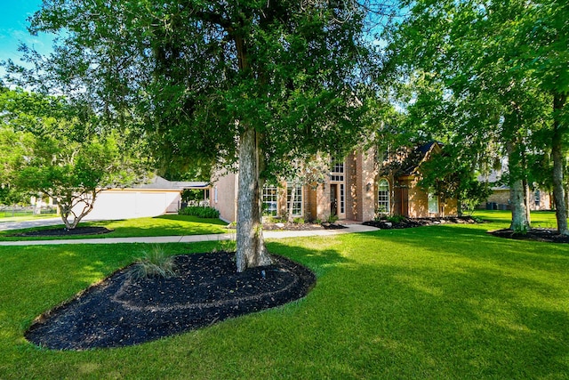 8819 Aubrey Ln, Richmond, TX 77469 - obstructed view of property with a front lawn