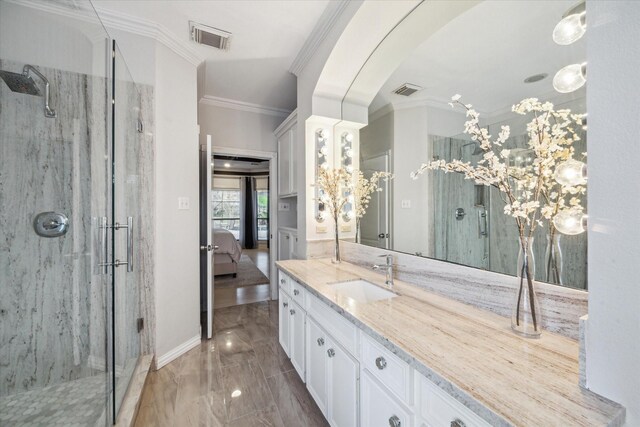 9108 Quail Ridge Dr, Manvel, TX 77578 - ensuite bathroom featuring visible vents, ornamental molding, a stall shower, and vanity