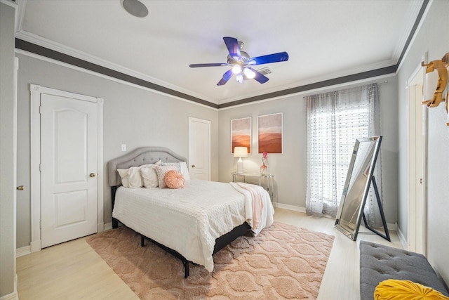 9108 Quail Ridge Dr, Manvel, TX 77578 - bedroom featuring ornamental molding, ceiling fan, wood finished floors, and baseboards