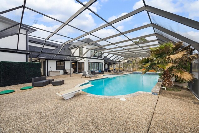 9108 Quail Ridge Dr, Manvel, TX 77578 - outdoor pool with a diving board, a patio area, glass enclosure, and an outdoor living space
