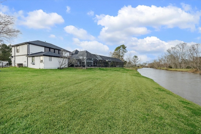 9108 Quail Ridge Dr, Manvel, TX 77578 - view of yard featuring a lanai, a water view, and concrete driveway