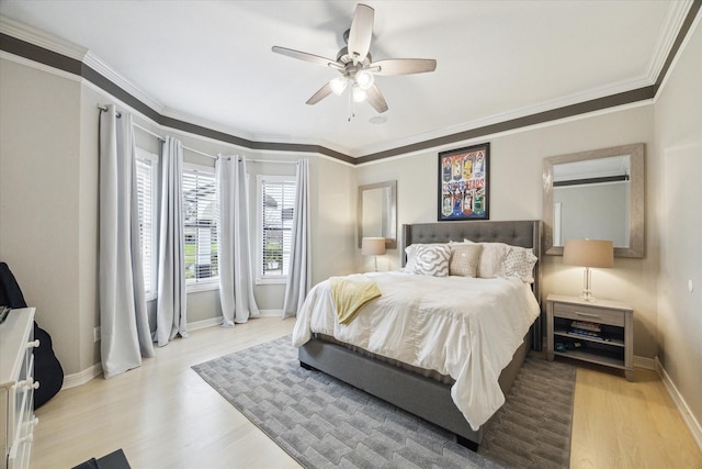 9108 Quail Ridge Dr, Manvel, TX 77578 - bedroom with baseboards, wood finished floors, ceiling fan, and crown molding