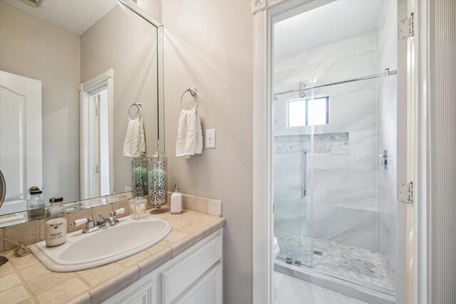 9108 Quail Ridge Dr, Manvel, TX 77578 - full bathroom with a shower stall, toilet, and vanity