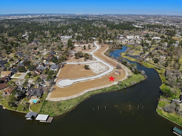 drone / aerial view featuring a residential view and a water view