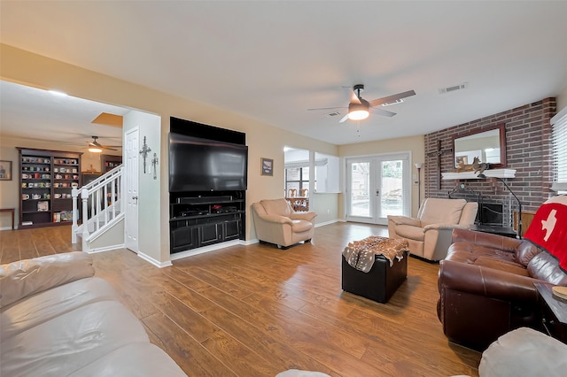 2307 Country Place Dr, Richmond, TX 77406 - living area with stairs, wood finished floors, visible vents, a ceiling fan, and baseboards
