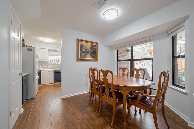 2307 Country Place Dr, Richmond, TX 77406 - dining space featuring dark wood-style flooring, baseboards, and visible vents