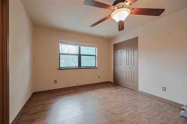 2307 Country Place Dr, Richmond, TX 77406 - unfurnished bedroom featuring ceiling fan, a closet, baseboards, and light wood-style floors