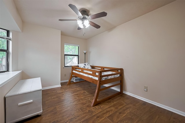 2307 Country Place Dr, Richmond, TX 77406 - bedroom featuring baseboards, dark wood finished floors, and ceiling fan