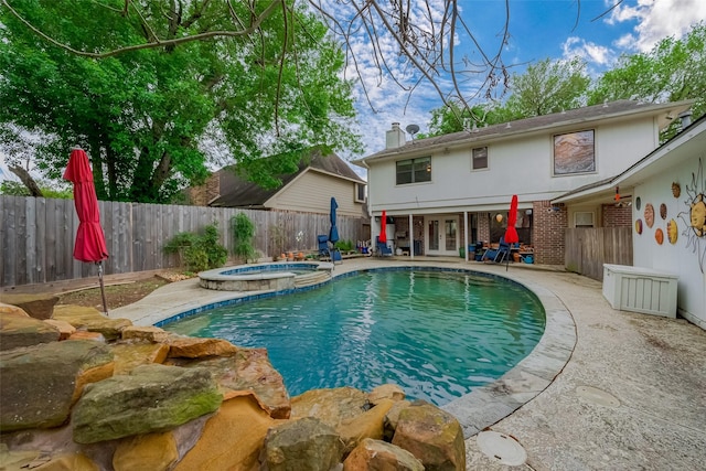 2307 Country Place Dr, Richmond, TX 77406 - view of pool featuring a fenced backyard, a patio, french doors, and a pool with connected hot tub