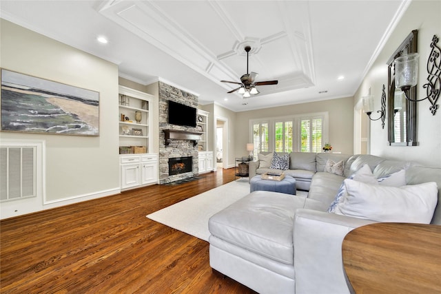 living room featuring crown molding, dark wood-style flooring, ceiling fan, and visible vents