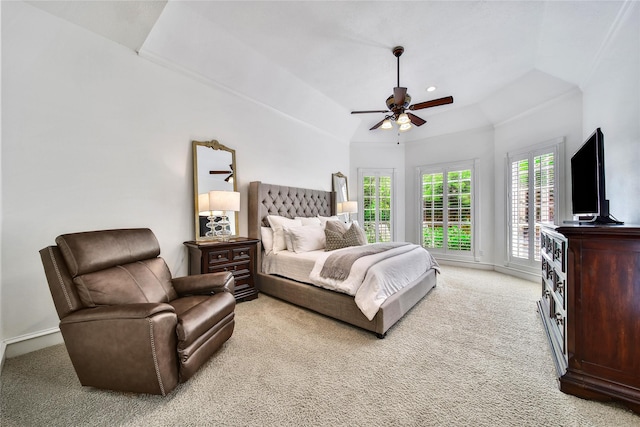 bedroom featuring baseboards, ceiling fan, lofted ceiling, and light colored carpet