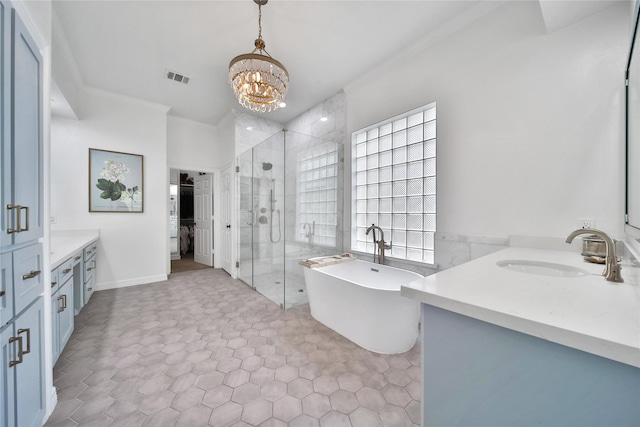 bathroom featuring visible vents, crown molding, a stall shower, two vanities, and a sink