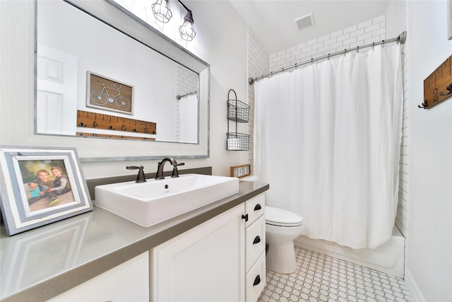 bathroom with visible vents, shower / bath combo with shower curtain, toilet, and vanity