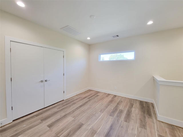 5931 Beall St Unit D, Houston, TX 77091 - unfurnished bedroom with visible vents, recessed lighting, light wood finished floors, and baseboards