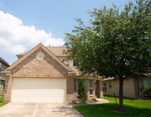 view of front of home with an attached garage, a front lawn, brick siding, and driveway
