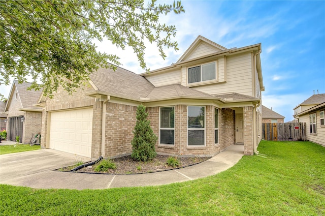 traditional-style home featuring brick siding, fence, an attached garage, concrete driveway, and a front yard