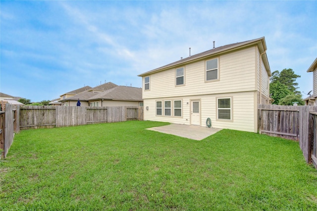 rear view of property with a patio area, a lawn, and a fenced backyard