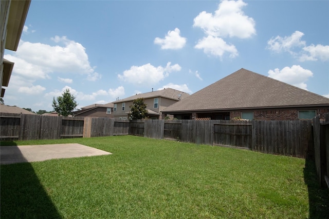 view of yard with a patio and a fenced backyard