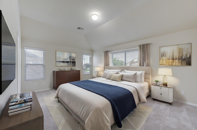 bedroom featuring lofted ceiling, light carpet, baseboards, and visible vents