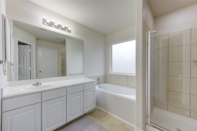 full bath featuring vanity, visible vents, tile patterned floors, a shower stall, and a garden tub
