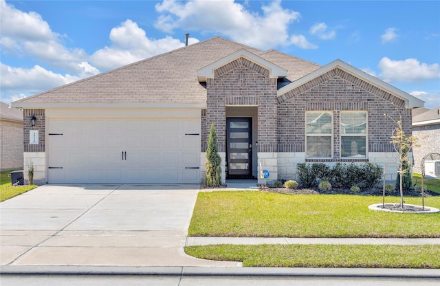ranch-style house with driveway, a front yard, a garage, brick siding, and a shingled roof