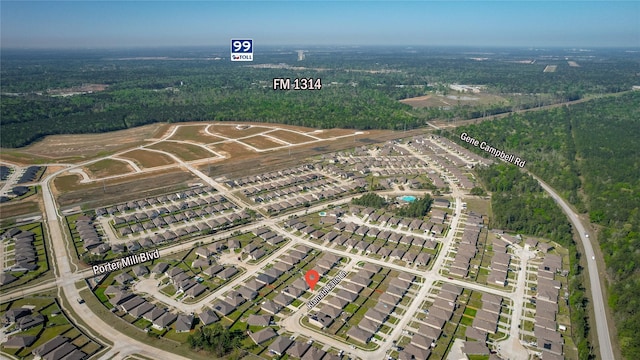 birds eye view of property with a wooded view