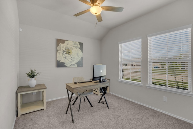office with baseboards, vaulted ceiling, plenty of natural light, and carpet