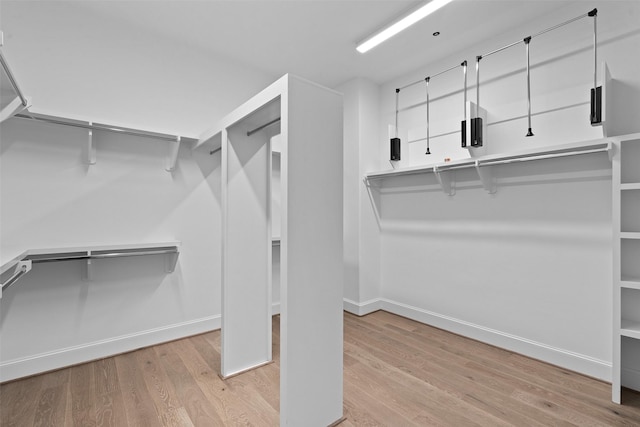 8711 Park Kolbe Ln, Houston, TX 77080 - walk in closet with wood finished floors