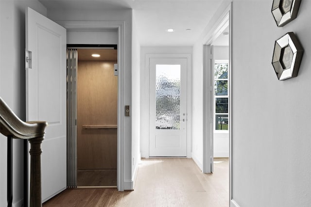 8711 Park Kolbe Ln, Houston, TX 77080 - hall featuring recessed lighting, wood finished floors, and baseboards
