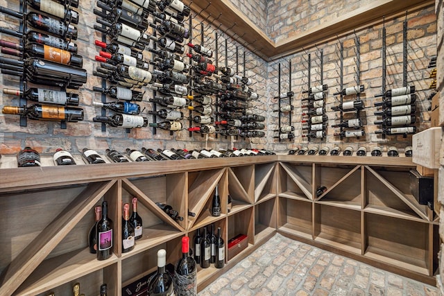 wine cellar featuring brick floor