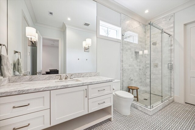 bathroom featuring toilet, vanity, visible vents, a stall shower, and crown molding