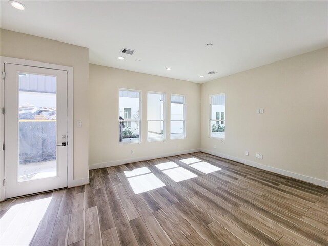 5931 Beall St A-B, Unit A-B Houston, TX 77091 - unfurnished living room featuring recessed lighting, visible vents, wood finished floors, and baseboards