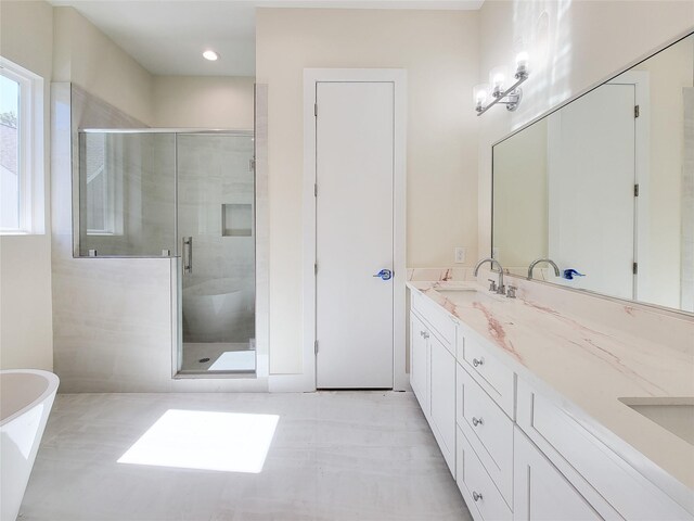 5931 Beall St A-B, Unit A-B Houston, TX 77091 - bathroom with double vanity, a freestanding bath, a stall shower, and a sink