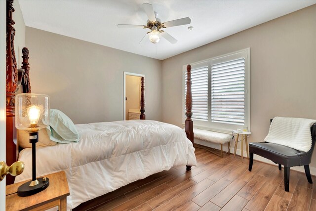 bedroom featuring baseboards, ceiling fan, and wood finished floors