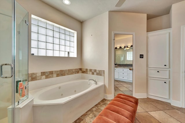 full bathroom with vanity, tile patterned flooring, a jetted tub, a shower stall, and a ceiling fan