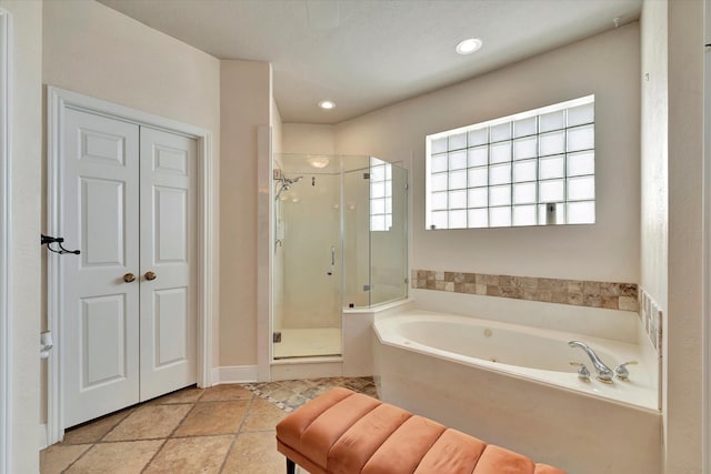 full bath featuring recessed lighting, a stall shower, and a bath