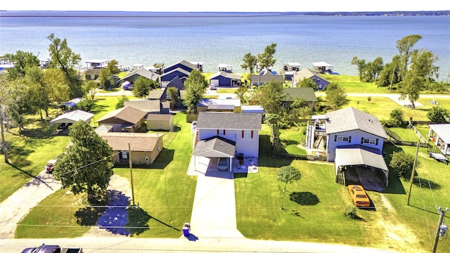 drone / aerial view with a residential view and a water view