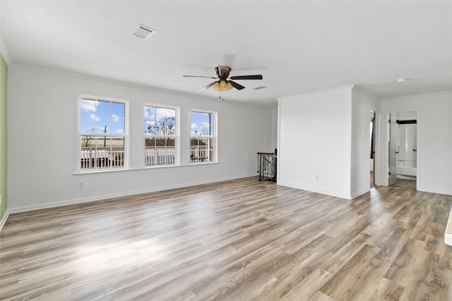 unfurnished living room with crown molding, light wood finished floors, a ceiling fan, and baseboards