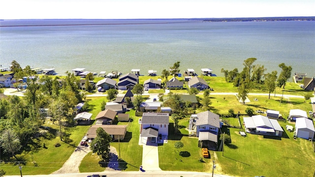 birds eye view of property featuring a water view and a residential view
