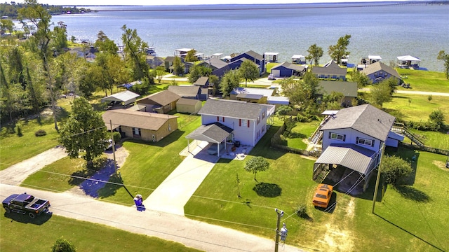bird's eye view with a water view and a residential view
