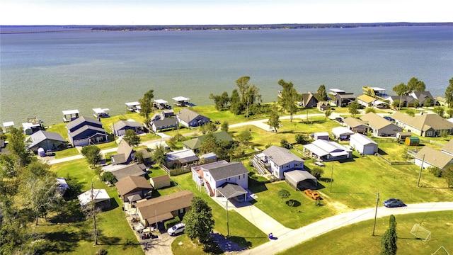 bird's eye view featuring a residential view and a water view