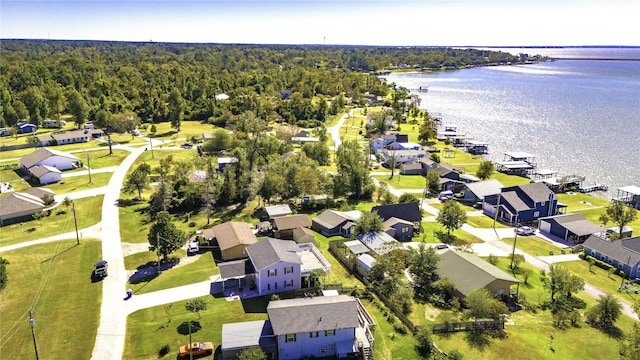 aerial view with a residential view, a water view, and a wooded view