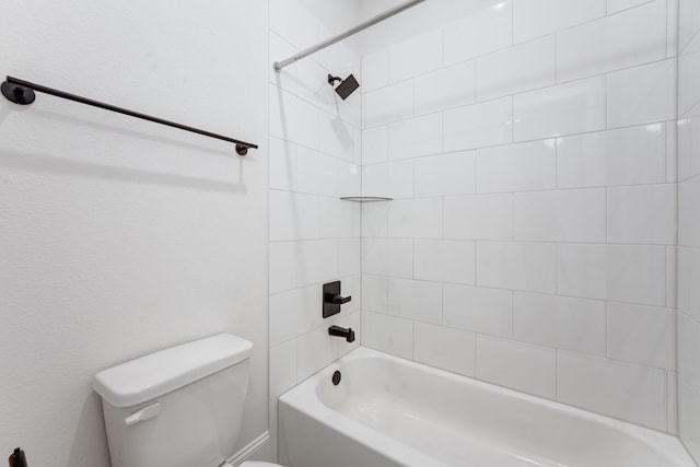 bathroom with washtub / shower combination and toilet