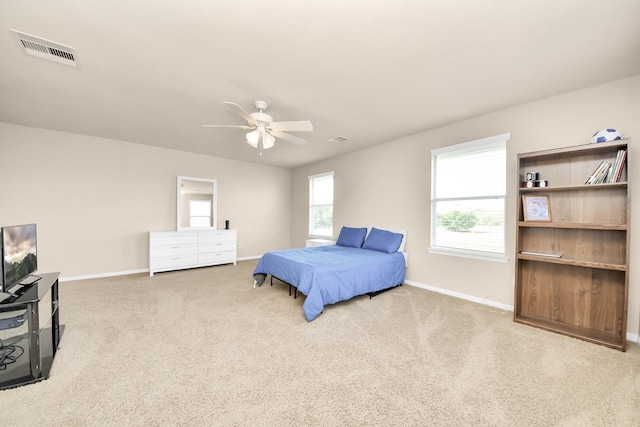 bedroom featuring baseboards, a ceiling fan, carpet floors, and visible vents