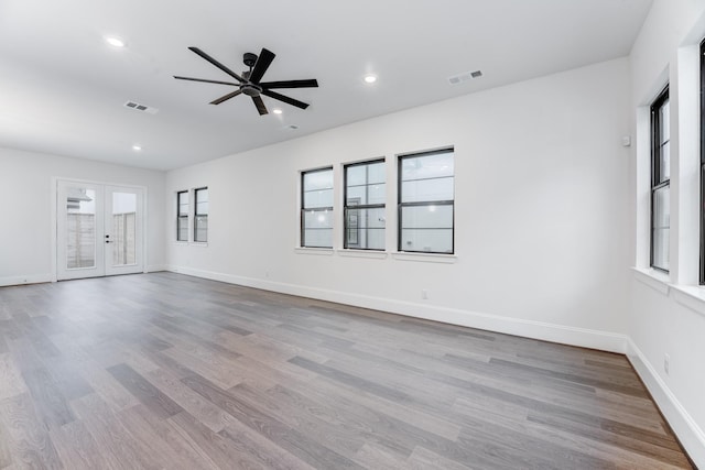 unfurnished living room featuring visible vents, wood finished floors, a ceiling fan, and recessed lighting