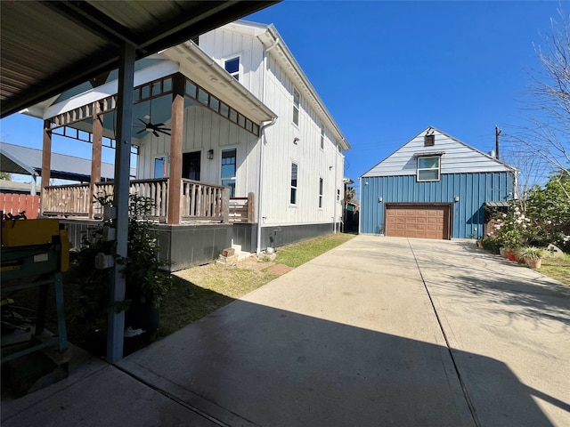 13505 Orleans St, Houston, TX 77015 - view of property exterior with board and batten siding, ceiling fan, an outdoor structure, and covered porch