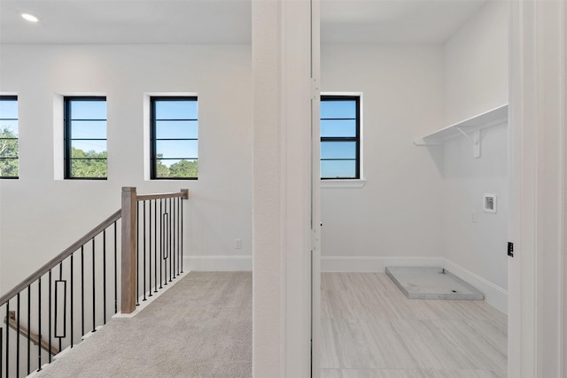 laundry room with recessed lighting, a wealth of natural light, washer hookup, and laundry area
