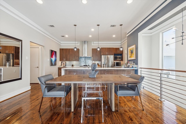 1946 Vermont St, Houston, TX 77019 - dining room with dark wood-style floors, ornamental molding, baseboards, and recessed lighting